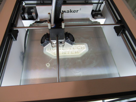 3D Printer printing a Howe Tech Center sign